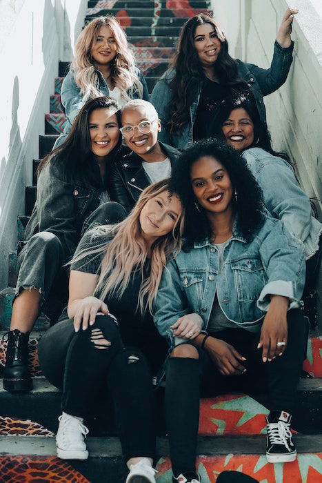 Group self portrait photography of friends on sitting on a stairwell