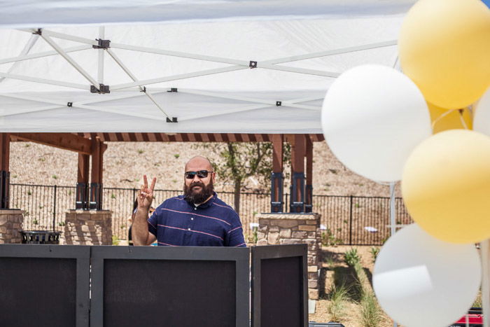 A man in a marquee surrounded by balloons - birthday party photography