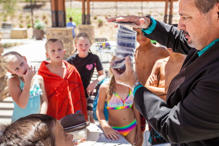 A magician performing at a kids birthday party - how to take good party pictures