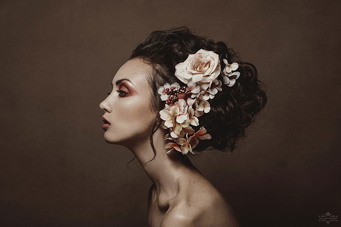 Statue-like side studio portrait of a female model by fine art photographer Ana Lora