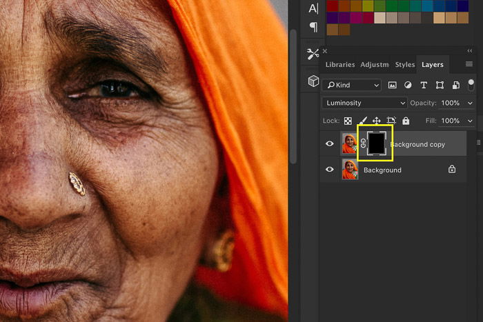 A screenshot showing image sharpening in Photoshop using a portrait of an Indian woman