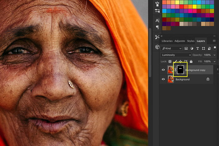 A screenshot showing image sharpening in Photoshop using a portrait of an Indian woman