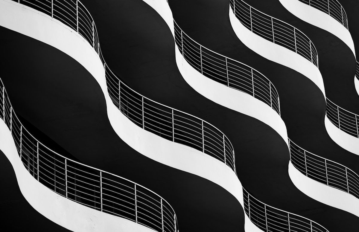 Blac-and-white wavy balconies forming an abstract pattern