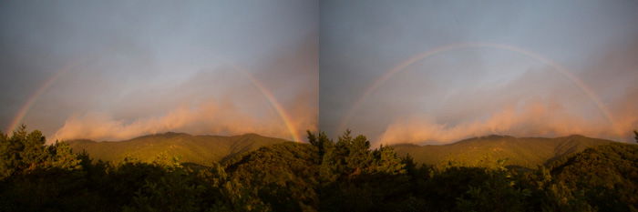 Part of a rainbow in front of an impressive landscape - pictures of rainbows 