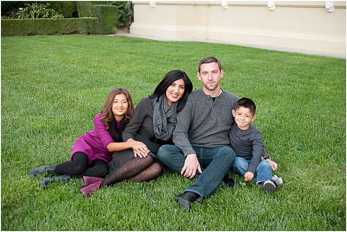 A family of four posing outdoors - take good pictures of people