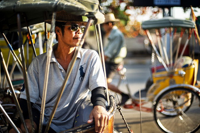 Asamlor rider sitting in his tricycle - shallow vs deep depth of field