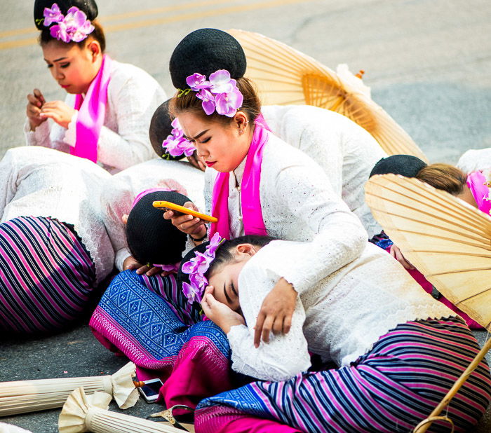 Performers who came early to prepare now rest before the parade commences. This provides an uncommon look at the parade. Narrative photography