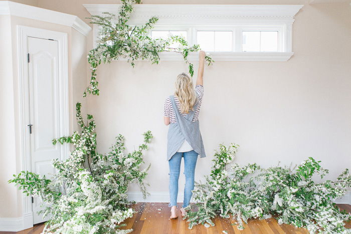 A photographer decorating their home photography studio 