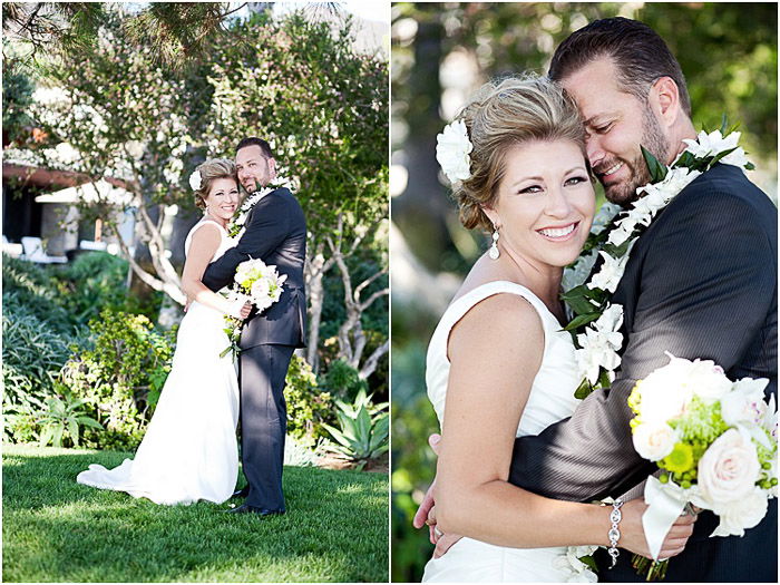 A newlywed couple posing outdoors in dappled light