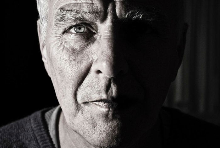 Dramatic portrait lighting with a close-up of an older man