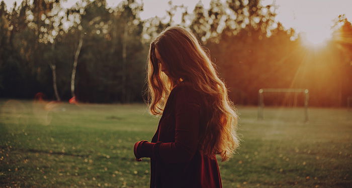 Dreamy photography shot of a female model posing outdoors