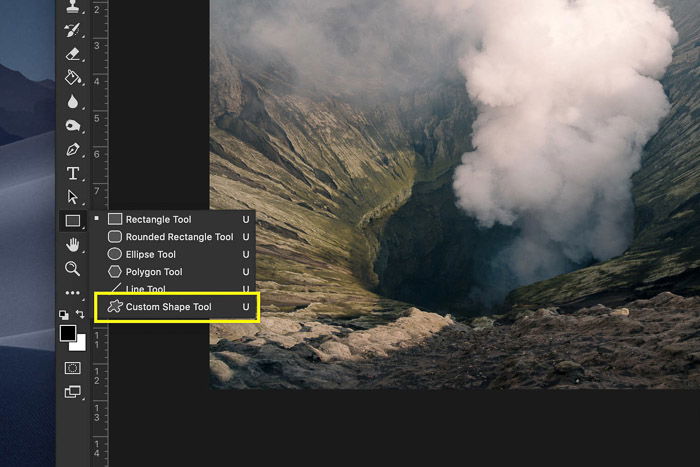 Selecting the custom shape tool in Photoshop