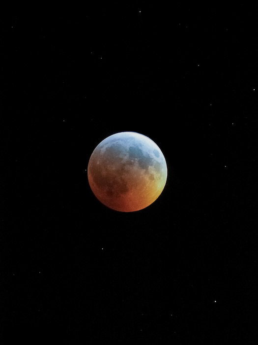 The moon showing a Turquoise Effect, right before totality.