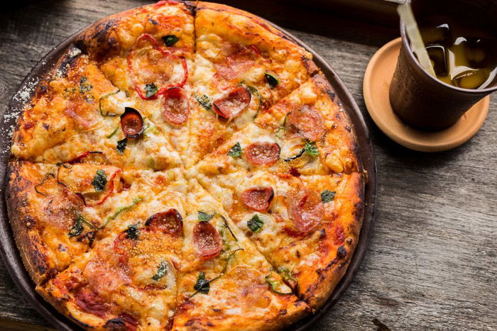 Food photography shot of pizza on a rustic background - how to build a website for photography