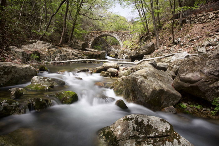 a long exposure of moving water shot during the day using a slow shutter speed