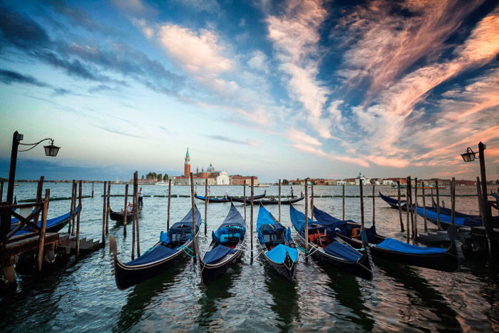 One of the classic Italy pictures are the lines of gondola's in Venice.