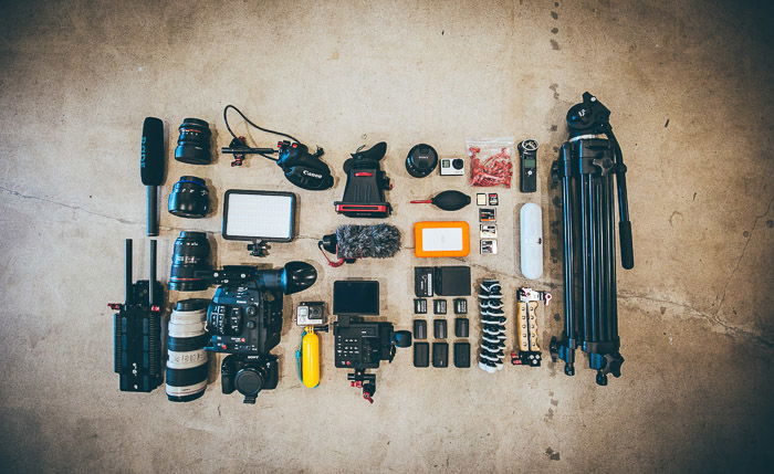 A flat lay photo of photography equipment 