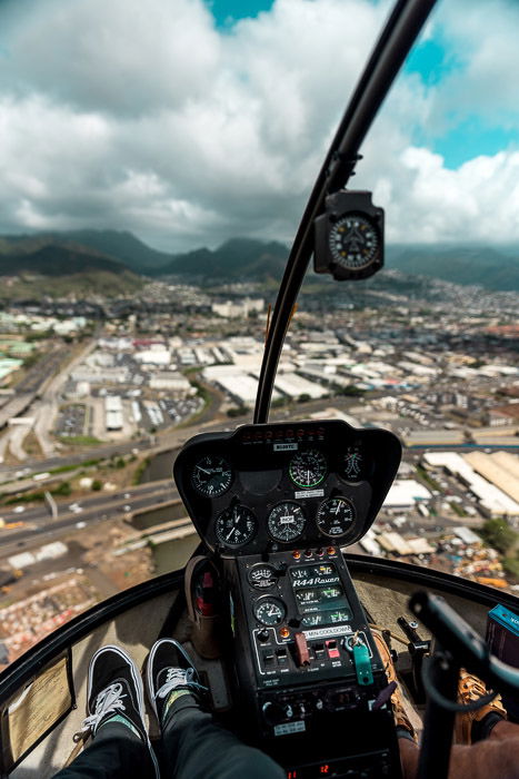 A view from the interior of a helicopter in mid flight