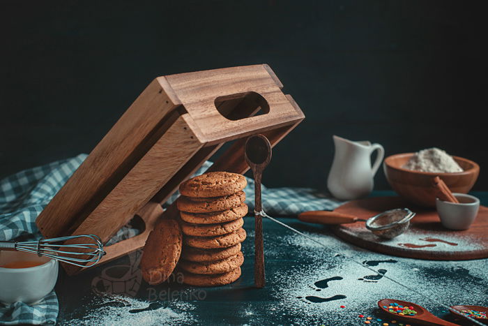 Creative food still life including coffee cups, cookie cutters, sugar and cookies