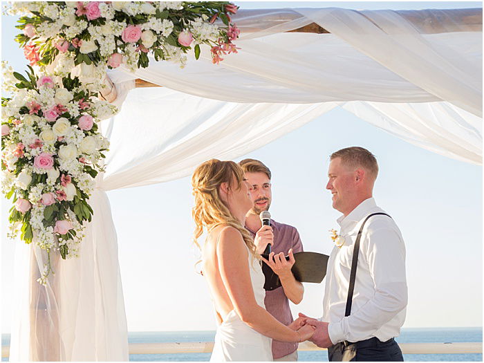 A wedding portrait the couple being married outdoors - wedding flash photography