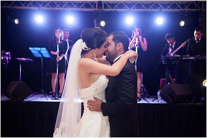 A wedding portrait of the couple dancing indoors - wedding flash photography