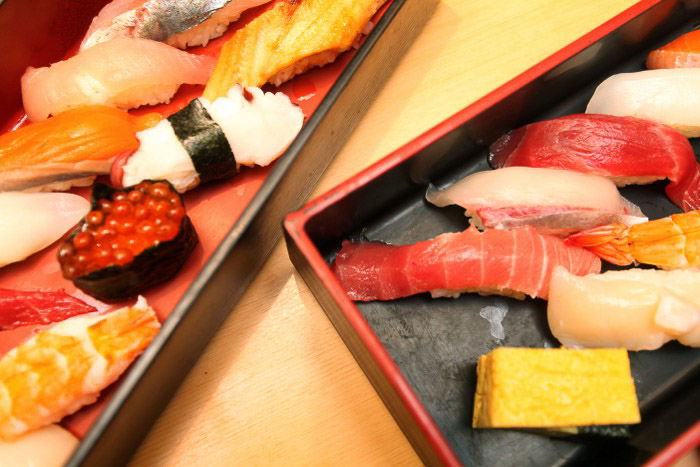 A close up food photo of plates of sushi 