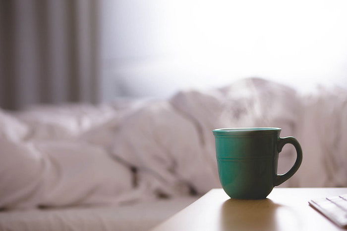 A coffee cup of hot coffe surrounded by steam- how to photograph steam in food photography