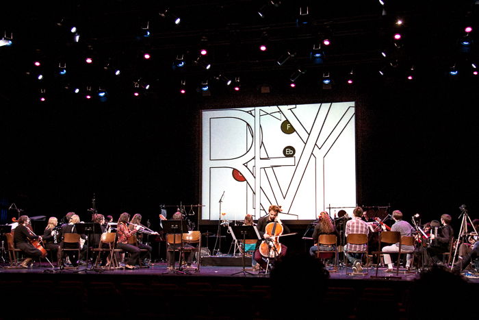 A stage photography shot of musicians performing at a classical music concert