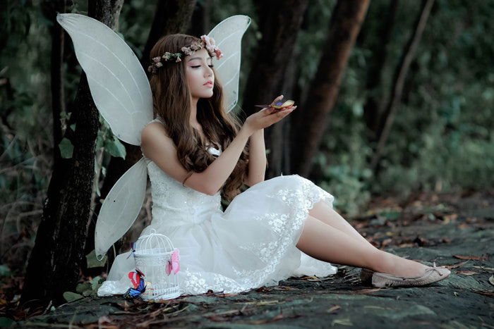 Woman in a fairy costume in the woods