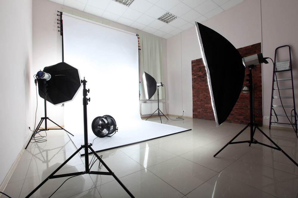 A photography studio set up with various equipment.