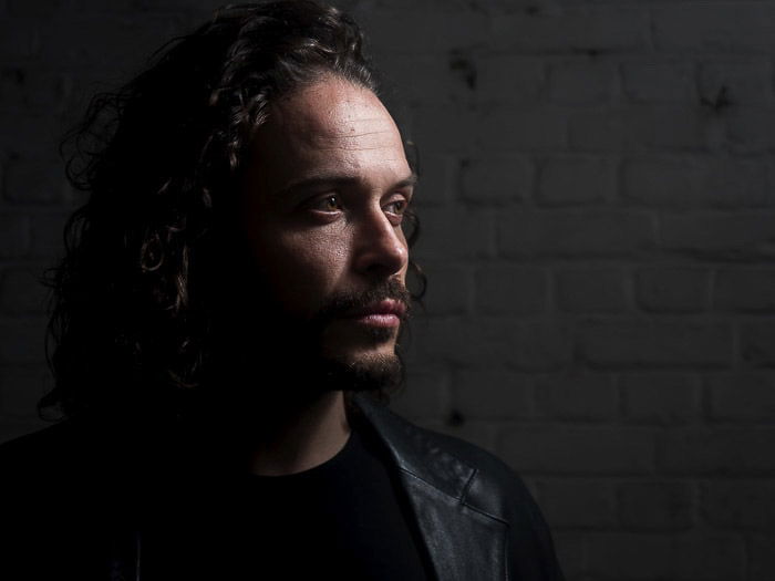 Studio portrait of a male model shot with short lighting techniques