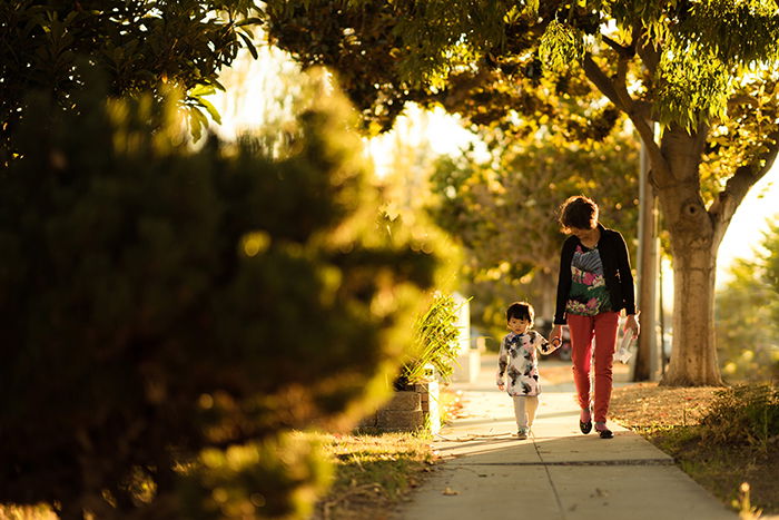 A mother and child walking down a path in evening light - lifestyle portrait tips 