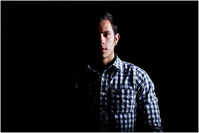 Atmospheric portrait of a male model taken in a portable photo studio