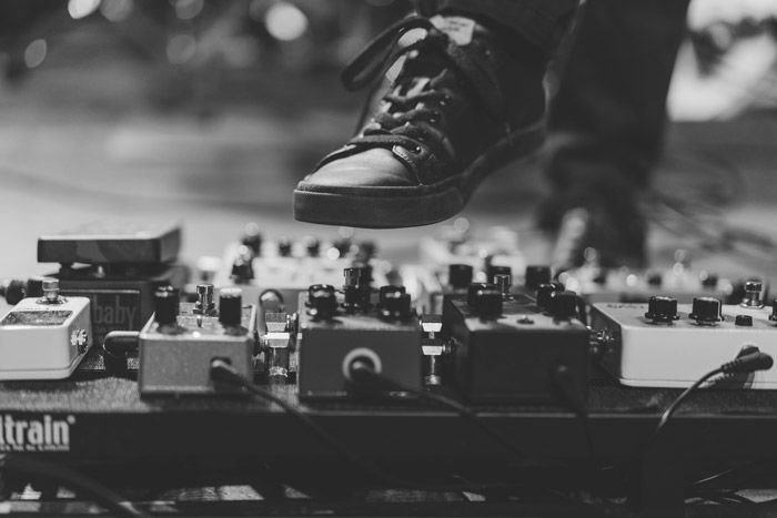 Atmospheric close up of a performers foot onstage at a festival