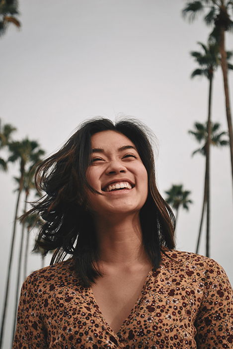 A female model smiling naturally for a portrait