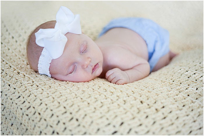 A sweet portrait of a newborn baby taken in a portable photo studio