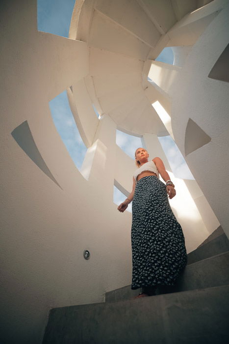 A female model posing indoors for a fashion lookbook shoot