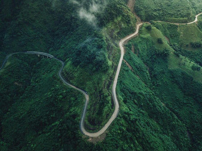 a beautiful aerial shot of a luscious mountainous landscape - stunning landscape photos 