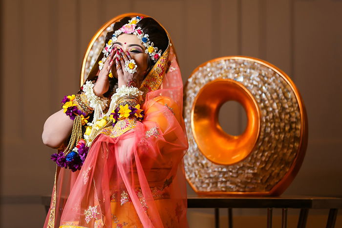 Beautiful wedding portrait of an Indian bride posing in traditional costume - Indian wedding photography