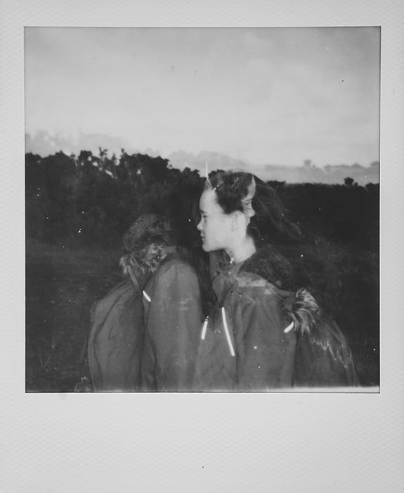 Monotone instant photography portrait of a young girl using a multiple exposure technique