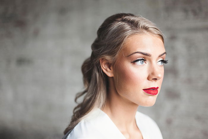 Striking portrait of a female model posing for a makeup photography shoot