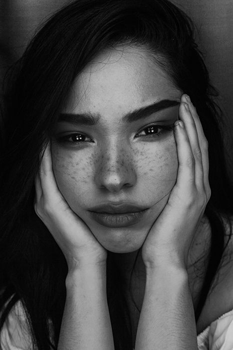 Black and white portrait of a beautiful female model posing for a makeup photography shoot