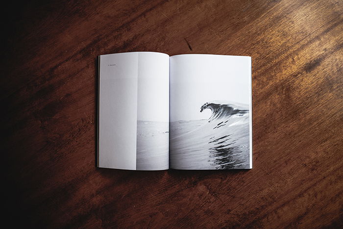 A printed photo book on a wooden table