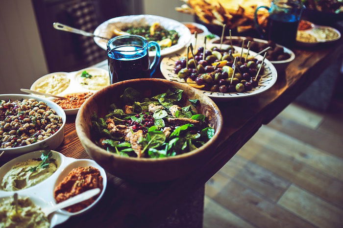 A food photography shot of thanksgiving dishes on a wooden table