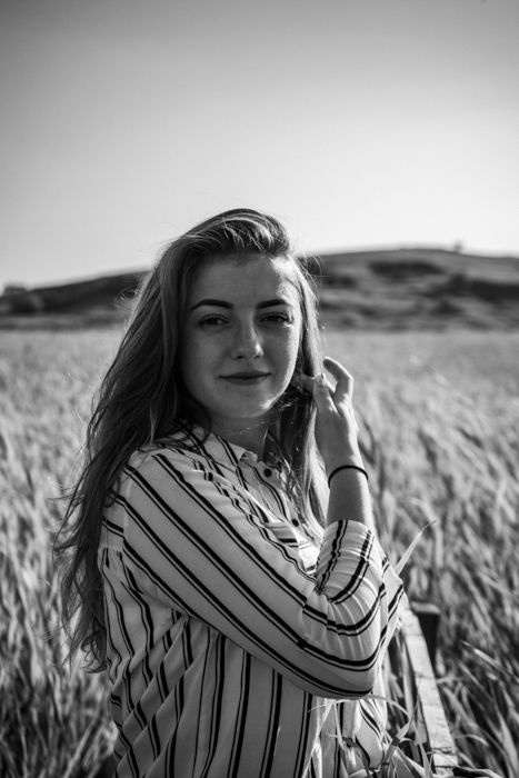 black and white vintage portrait of a female model posing outdoors