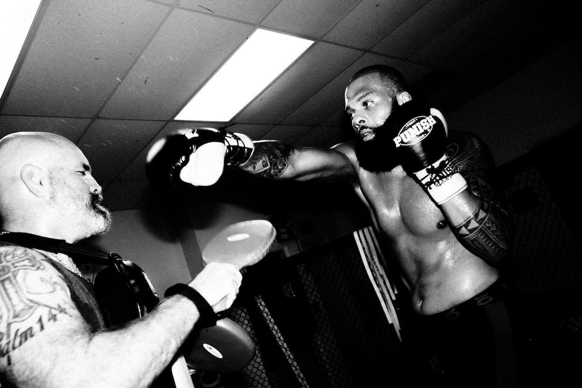 A boxer sparring with his coach as an example of boxing photography