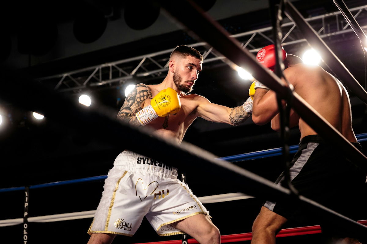 A picture of two boxers sparring as an example of boxing photography shot from below ringside