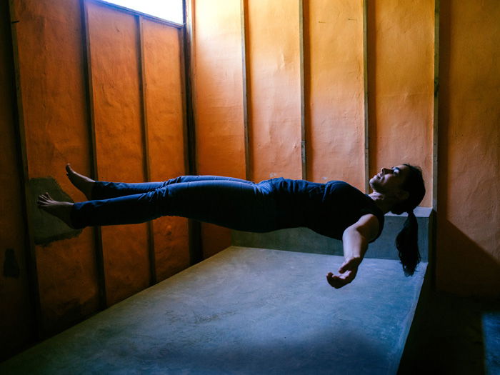 A cool levitation photo of a floating female model