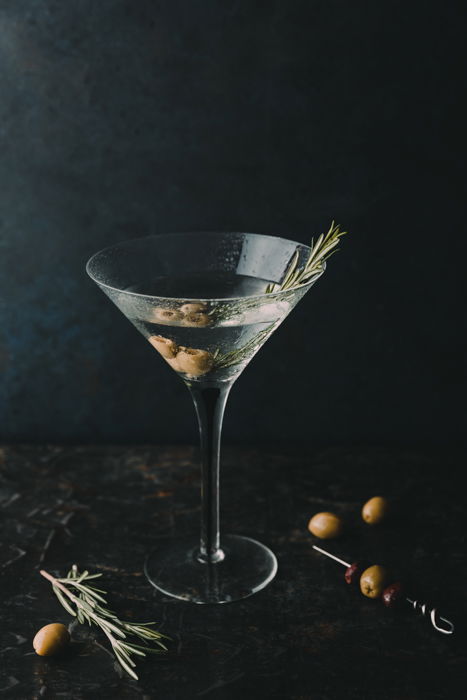 Stylish drink photography of a martini cocktail against a dark background