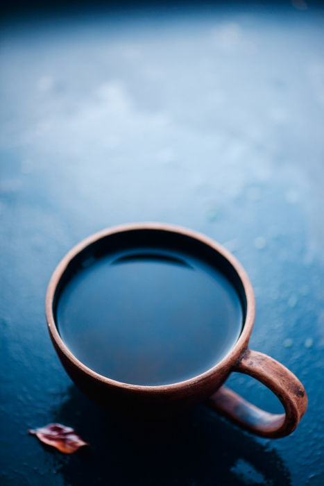 a still life setup featuring creative reflections in a coffee cup